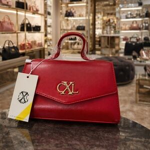 Red Leather Top-Handle Bag by Christian LaCroix with crossbody chain